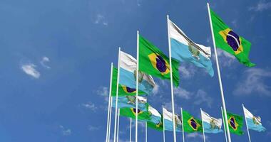 san Marino und Brasilien Flaggen winken zusammen im das Himmel, nahtlos Schleife im Wind, Raum auf links Seite zum Design oder Information, 3d Rendern video