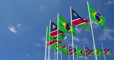 namibia e brasile bandiere agitando insieme nel il cielo, senza soluzione di continuità ciclo continuo nel vento, spazio su sinistra lato per design o informazione, 3d interpretazione video