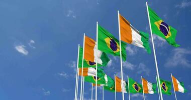 Ivory Coast and Brazil Flags Waving Together in the Sky, Seamless Loop in Wind, Space on Left Side for Design or Information, 3D Rendering video