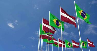 Latvia and Brazil Flags Waving Together in the Sky, Seamless Loop in Wind, Space on Left Side for Design or Information, 3D Rendering video