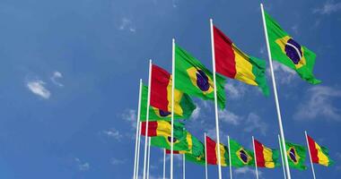 Guinea and Brazil Flags Waving Together in the Sky, Seamless Loop in Wind, Space on Left Side for Design or Information, 3D Rendering video