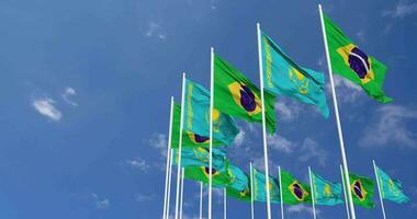 Kazakhstan and Brazil Flags Waving Together in the Sky, Seamless Loop in Wind, Space on Left Side for Design or Information, 3D Rendering video