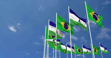 Lesotho und Brasilien Flaggen winken zusammen im das Himmel, nahtlos Schleife im Wind, Raum auf links Seite zum Design oder Information, 3d Rendern video