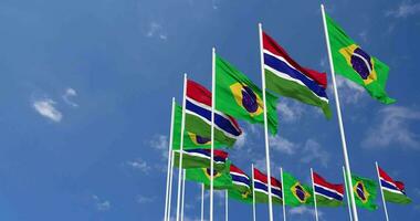 Gambia and Brazil Flags Waving Together in the Sky, Seamless Loop in Wind, Space on Left Side for Design or Information, 3D Rendering video