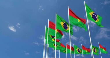 Burkina Faso and Brazil Flags Waving Together in the Sky, Seamless Loop in Wind, Space on Left Side for Design or Information, 3D Rendering video