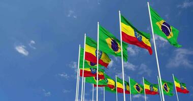 etiopien och Brasilien flaggor vinka tillsammans i de himmel, sömlös slinga i vind, Plats på vänster sida för design eller information, 3d tolkning video