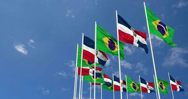 Dominican Republic and Brazil Flags Waving Together in the Sky, Seamless Loop in Wind, Space on Left Side for Design or Information, 3D Rendering video