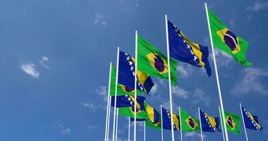 Bosnien und Herzegowina und Brasilien Flaggen winken zusammen im das Himmel, nahtlos Schleife im Wind, Raum auf links Seite zum Design oder Information, 3d Rendern video