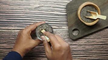 close up of chia seeds in a glass of water video