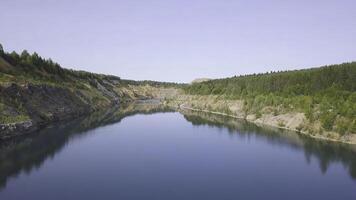 Beautiful sunny day in mountain landscape. Clip. Blue lake on a Sunny day photo