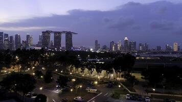 Top view of cityscape at Sand Sky Park Singapore at twilight time. Shot. Top view of Singapore in the evening photo