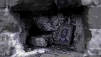 Holy Icon in the rocky wall. Footage. Icon in frame for prayer photo
