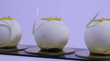 Velvet cake balls with sugar sprinkles. White, ball-shaped cakes. Decorative white cakes photo