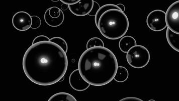 Black background. Design. Large white bubbles in animation on a dark background scatter in different directions. photo