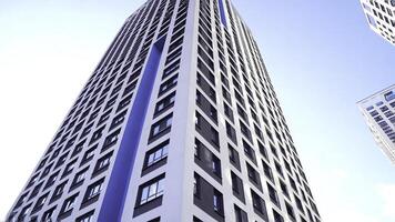 Bottom view of new residential high-rise buildings with blue sky. Urban environment. Frame. Newest residential complexes with an eco-friendly environment photo