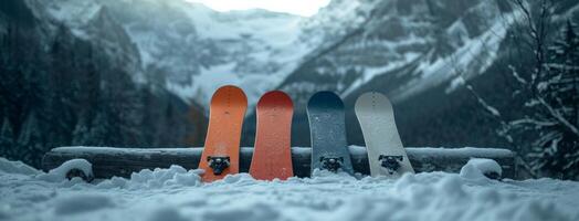 ai generado cuatro tablas de snowboard acostado en contra un montaña en frente de oscuro bosque foto