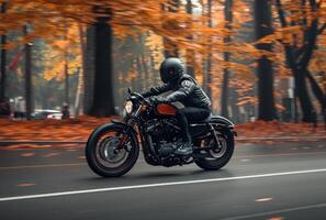 ai generado un negro y naranja motorista montando abajo un la carretera en otoño foto