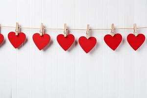 AI generated Red hearts hang on wooden clothes pegs on white color background, Happy valentine day concept photo