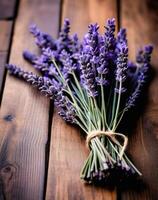 ai generado manojo de lavanda flores en de madera fondo, selectivo enfocar. foto