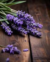 ai generado manojo de lavanda flores en de madera fondo, selectivo enfocar. foto