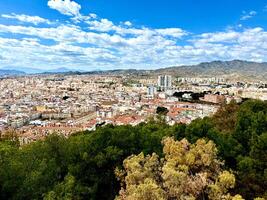 Aerial photo of a panoramic view of the city with red roofs and mountains. Old town,Costa del sol, Andalusia. Europe.