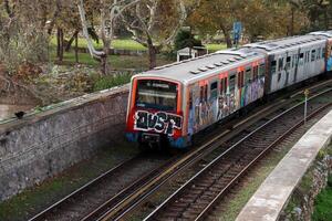 Athens, Greece, December 14 2023 A train that run beside the Ancient Agora in Athens photo