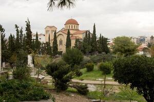 The Ruins at The Roman Agora with the Church of Saint Marina in background photo