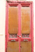 Old Rustic Wooden door in the city of Athens, Greece photo