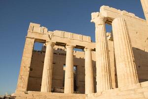 Some of the many ruins of temples and other structures that can be found on top of the Acropolis in Athens, Greece photo