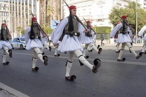 Athens, Greece, December 24 2023 Soldier of the Presidential Guard marching toward the Parliament for the ceremonial changing of the guard of The Tomb of the Unknown Soldier. photo