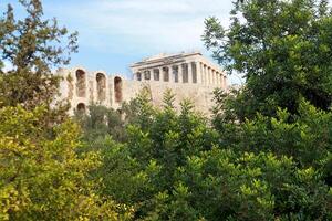 View of part of the Odeon of Herodes Atticus Theater foreground and the Parthenon in background photo