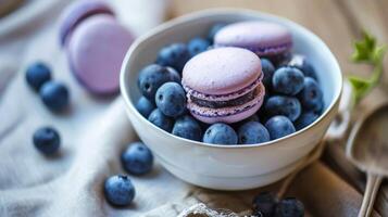 AI generated A bowl of blueberries and macaroons on a table photo