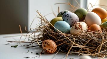 AI generated A nest filled with different colored eggs on top of a white table next to a pile of straw on top of a white surface photo