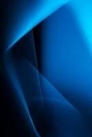 Abstract vertical black and blue background banner with smooth lines. intersections, angles and gradient. Backdrop. Design element photo