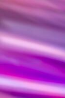 Abstract vertical background with smooth horizontal lines in waves of purple and pink colors with a gradient. photo