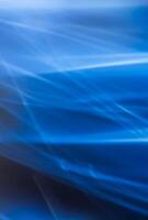 Abstract vertical blue background with smooth lines and blur, light refraction and waves. Backdrop. photo