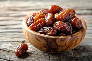 AI generated a wooden bowl filled with dates on a table photo