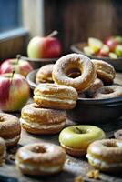 AI generated A delicious assortment of donuts and apples on a rustic wooden table photo