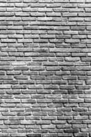 Black and white vertical brick wall background for texture and copy space photo