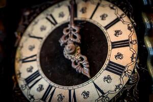 Close up number of Ancient Clock five o clock for vintage background photo