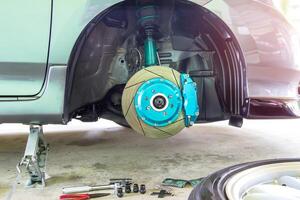 Car service concept brake wheel brake pad bolt jack and tool equipment for maintenance photo
