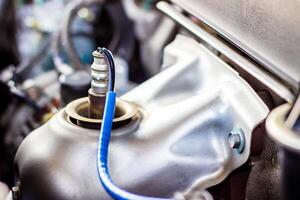 Close up Oxygen or intake sensor in engine room part of automobile concept photo