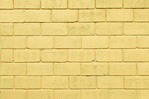 Light yellow color brick wall close up image row brick and cement block background and texture photo