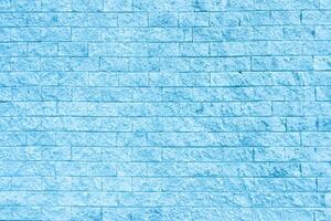 Light blue color brick wall close up image row brick and cement block background and texture photo