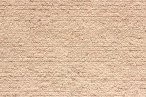 Light orange color brick wall close up image row brick and cement block background and texture photo