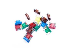 Old Car fuse colorful color on white background micro size use for protection in electric system of car photo