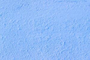 Light blue Plaster walls are not smooth and crack surface vintage style for design work background texture and copy space photo