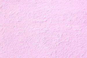Light pink Plaster walls are not smooth and crack surface vintage style for design work background texture and copy space photo