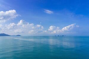 Nature view of the sea and mountain,clear blue sky and white cloud background texture photo