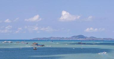Panoramic Sea view sand beach with boat and blue sky nature view at Pattaya beach Thailand photo
